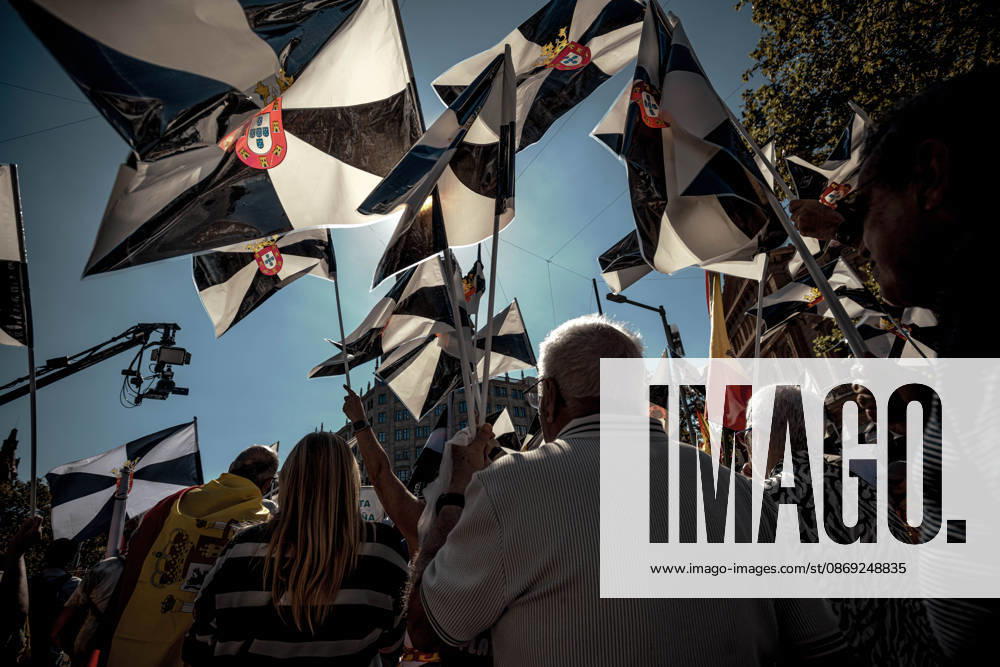 Demonstrators wave flags of Ceuta during a rally marking Spainâ€⠢s National Day. Barcelona Spain - ZUMAo105 20261012_fap_o105_012