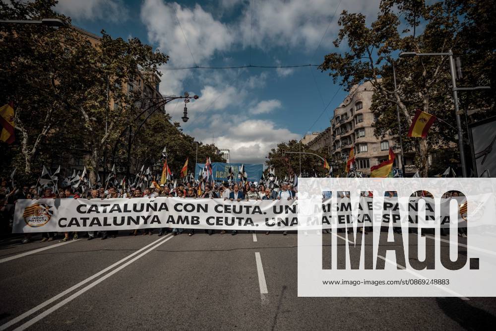 Demonstrators march behind a banner reading Catalonia with Ceuta. One Spain during a rally marking SpainÃ¢â‚¬â ¢s National Day. Barcelona Spain - ZUMAo105 20261012_fap_o105_019