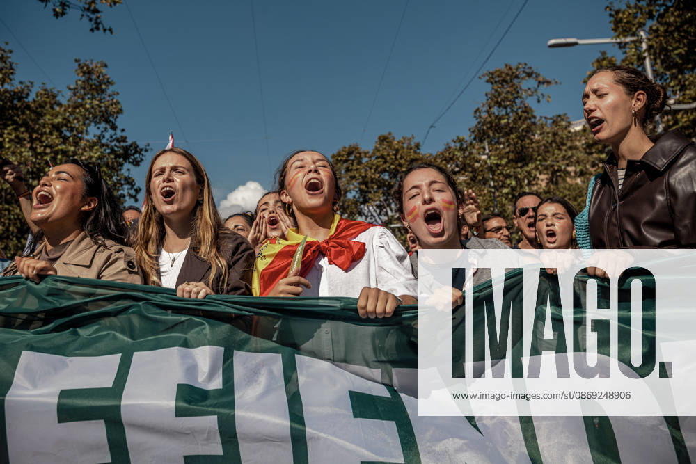 Demonstrators chant slogans behind a banner during a rally marking Spainâ€⠢s National Day. Barcelona Spain - ZUMAo105 20261012_fap_o105_024
