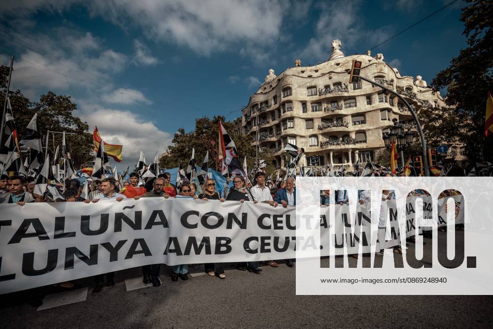 Demonstrators march behind a banner reading Catalonia with Ceuta. One Spain during a rally marking Spainâ€⠢s National Day. Barcelona Spain - ZUMAo105 20261012_fap_o105_031