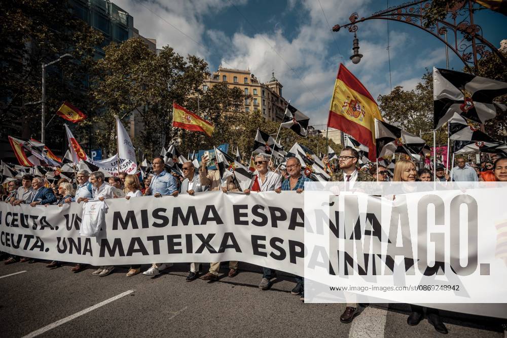 Demonstrators march behind a banner reading Catalonia with Ceuta. One Spain during a rally marking Spainâ€⠢s National Day. Barcelona Spain - ZUMAo105 20261012_fap_o105_033