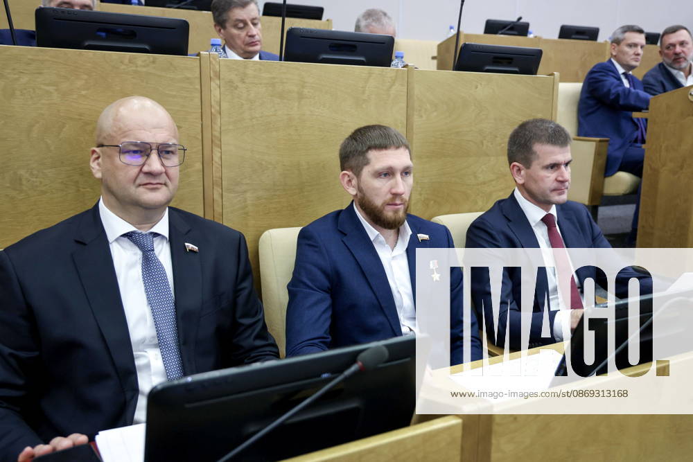 RUSSIA, MOSCOW - OCTOBER 13, 2026: Russian State Duma members Oleg Garin, Denis Portnyagin and Gennady Panin (L-R) attend a plenary meeting of the Russian State Duma. Russian State Duma Press Office TASS 99238616