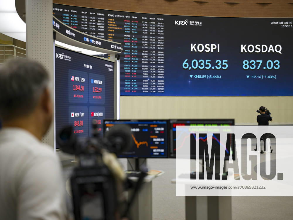 South Korea Stocks Plunge As KOSPI Drops Sharply At KRX In Seoul Media personnel and monitors in the Korea Exchange (KRX) trading hall display market data in Yeouido, Seoul, South Korea, on October 13, 2026. The KOSPI index dropped to 6,035.35, down 348.89 points (-5.46%), alongside the KRW USD exchange rate shown on side screens. Seoul Seoul South Korea