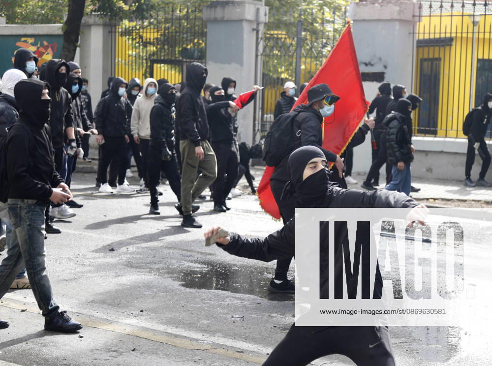Protesters Clash with Police During a Demonstration in Tirana, Albania. Protesters throw stones at riot police during an anti-government demonstration in central Tirana on October 15, 2026, as protests continued for a third consecutive day over university conditions and demands for the resignation of Albanian Prime Minister Edi Rama. The latest rally follows two nights of violence in the capital, during which protesters and riot police clashed, police used water cannons and tear gas, and demonstrators damaged government offices and shops and set fire to several buildings. Light Studio Agency Malton Dibra Tirana Albania