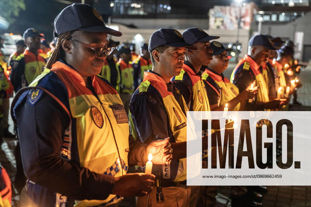 (261016) -- JOHANNESBURG, Oct. 16, 2026 -- Police officers attend a candlelight vigil calling for an end to gender-based violence and femicide (GBVF) in Johannesburg, South Africa, Oct. 15, 2026. The vigil follows widespread national outrage after the discovery of 11 women s bodies across the city of Ekurhuleni, east of Johannesburg, since July. (Photo by Shiraaz Mohamed Xinhua) SOUTH AFRICA-JOHANNESBURG-FEMICIDE-CANDLELIGHT VIGIL ChenxWei