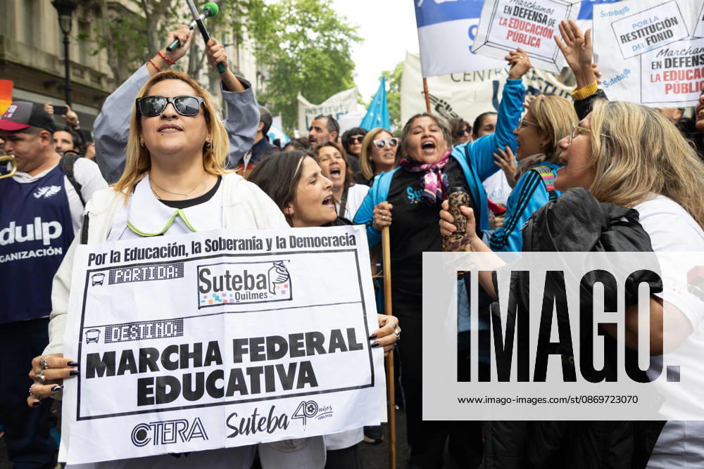 Teachers sing during the march towards Argentinas National Congress to demand compliance with the University Budget Law. Buenos Aires Argentina - ZUMAp265 20261016_zip_p265_037