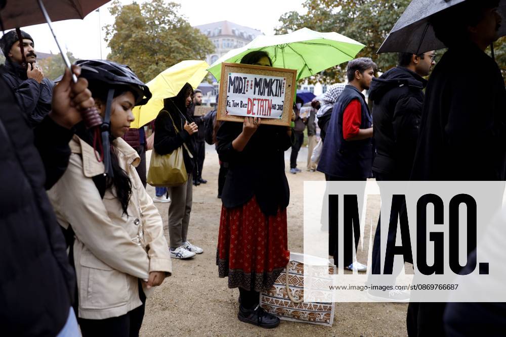 BERLIN, GERMANY - OCTOBER 17, 2026: A small group of demonstrators hold placards at Oranienplatz in the Kreuzberg district to show solidarity with mass protests in India and to protest against the crackdown on them, as several people take the floor to discuss the situation. The demonstration followed a call by Neha Bora, president of the All India Studentsâ€⠢ Association (AISA), for people everywhere to back the protests, saying â€oeeverywhere is Jantar Mantarâ€Â, the site in Delhi where the main protests are taking place. The protests demand the resignation of Chief Election Commissioner Gyanesh Kumar over a revision of electoral rolls that opponents say led to the mass deletion of voters, whi - ZUMAq101 20261017_zna_q101_074