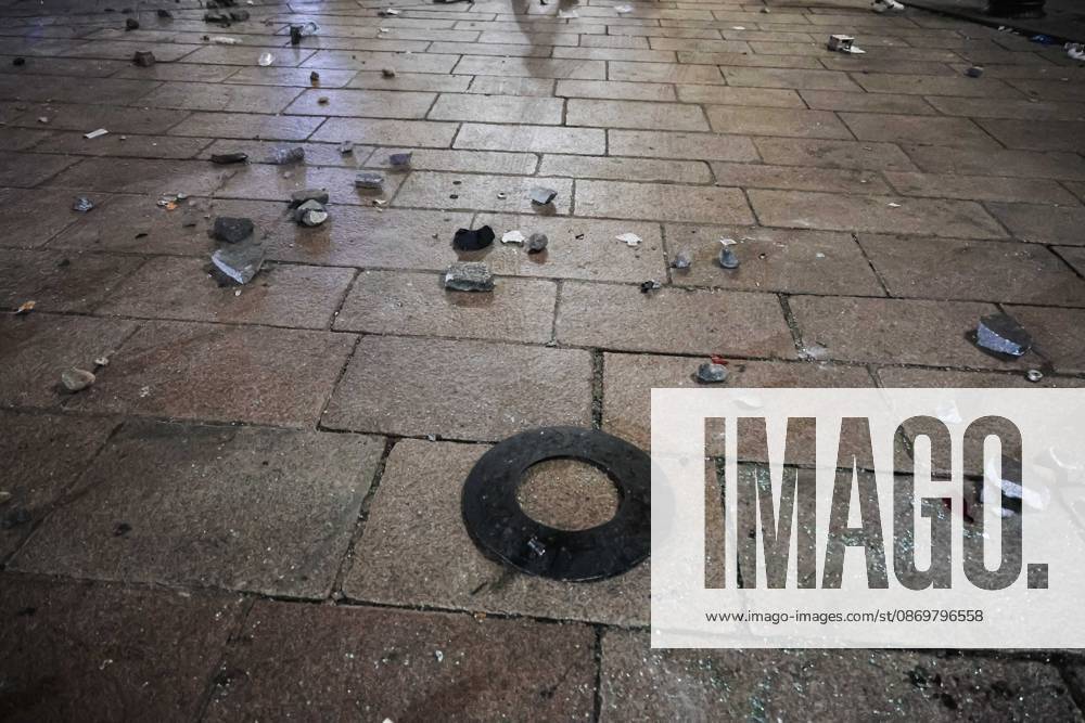 IPA89830548 - Milan: Damage caused by clashes between protesters and police during the Italia in Piazza demonstration against the high cost of living in the city center. Pictured: Damage in Piazza del Duomo