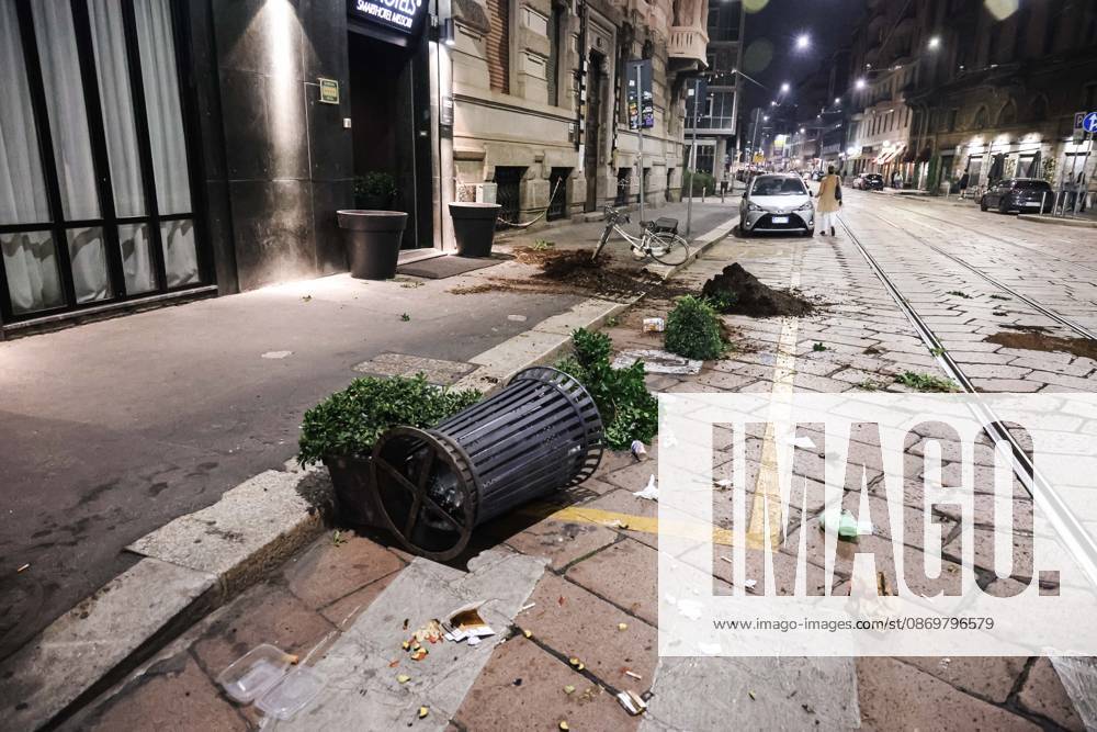 IPA89830559 - Milan: Damage caused by clashes between protesters and police during the Italia in Piazza demonstration against the high cost of living in the city center. Pictured: Damage on Missori Street