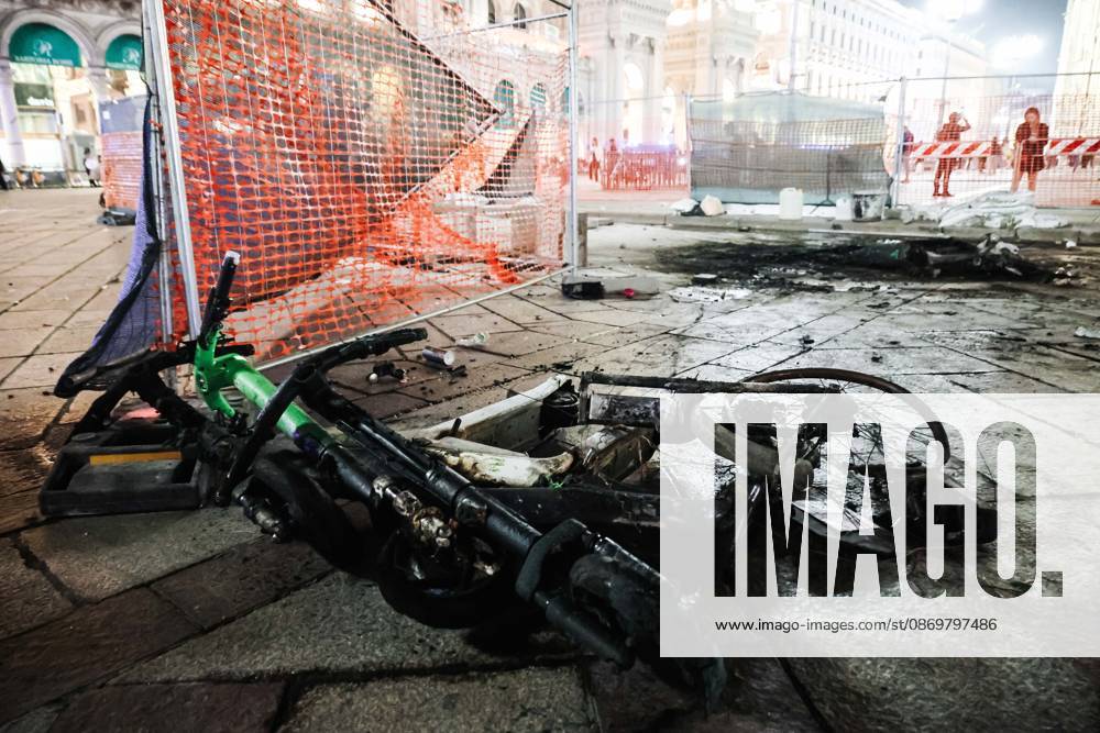 IPA89830552 - Milan: Damage caused by clashes between protesters and police during the Italia in Piazza demonstration against the high cost of living in the city center. Pictured: Damage in Piazza del Duomo