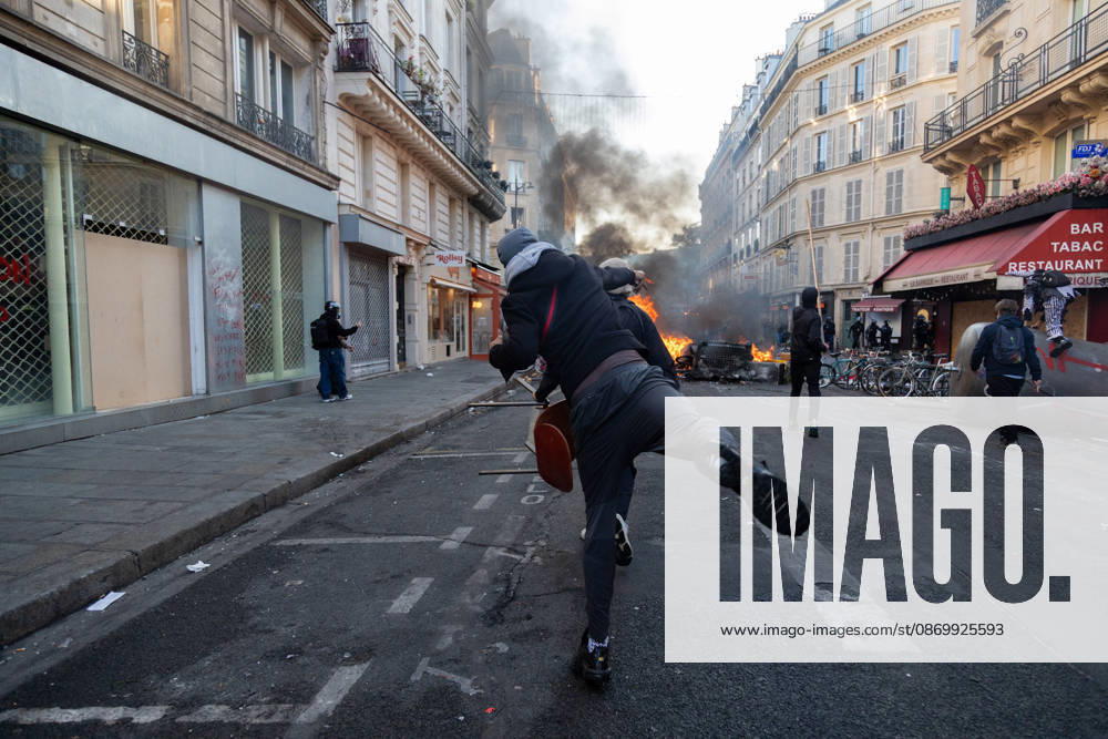 IPA89895984 - Paris, protest on October 18 near Place de la République; protesters clashed with police; a protester threw a bottle at the police
