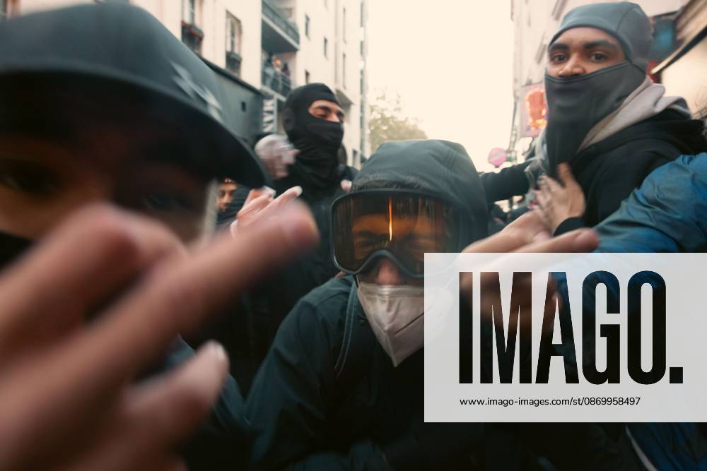 Second day of Paris riots PARIS, FRANCE - OCTOBER 18, 2026: Protesters clash with police near Place de la RÃ publique in Paris during a protest against austerity. Protesters set up makeshift barricades and start fires in the square and surrounding streets. After police clear the square, protesters attack nearby shops. Paris France