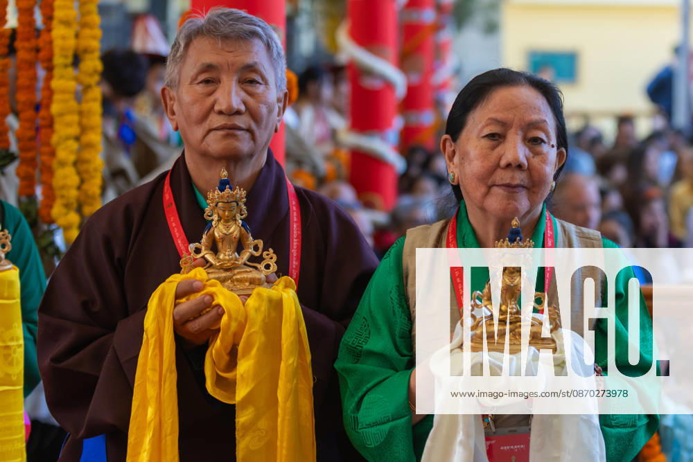 Exiled Tibetans standing in a queue with ceremonial offerings for Tibetan Spiritual leader the Dalai Lama during a Long Life Prayer offered to him by TIPA, Norbulingka Institute and Nepal Tibetan Lhamo Association at Tsuglakhang Temple, Mcleodganj, Dharamshala on Wednesday. Dharamshala India - ZUMAb235 20261021_zip_b235_040