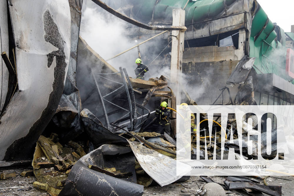 State Emergency Service rescue workers extinguish a fire caused by a Russian ballistic missile attack on an Epicentr K home improvement hypermarket and the surrounding shopping area in the Obolonskyi district, Kyiv, Ukraine, October 22, 2026. On Thursday night, Russian forces struck the Ukrainian capital with ballistic missiles and drones. According to the Kyiv City Military Administration, six districts came under attack. One person was killed, 24 were injured, and 16 of them were hospitalised. (Photo by Marianna Kotyk Ukrinform) Russian attack destroys shops in Kyiv