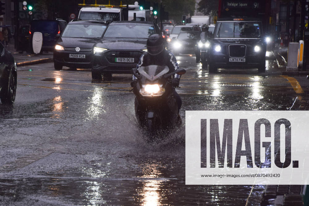 A motorcyclist passes through a waterlogged Euston Road as Storm Austen brings rain to the capital. London United Kingdom - ZUMAv130 20261023_zip_v130_007