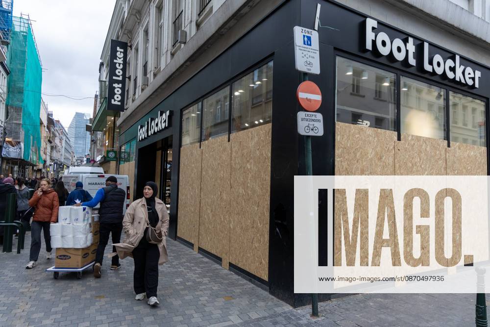Storefronts boarded up with wooden panels at Rue Neuve Nieuwstraat, in Brussels, on Friday 23 October 2026. Stores are preparing for another protest scheduled for Saturday. NICOLASxMAETERLINCK 190739531