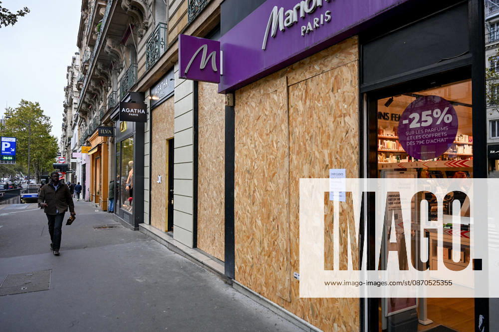 Stores Prepare for Demonstration - Paris Shopkeepers install wooden boards to barricade their shop windows in preparation for demonstration in Paris, France, on October 23, 2026. Photo by Ammar Abd Rabbo ABACAPRESS.COM Paris France