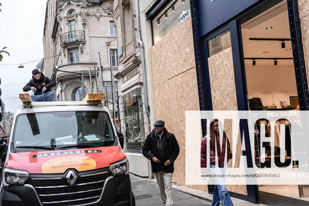 Shopfronts boarded up in Nancy ahead of planned protests NANCY, FRANCE - OCTOBER 23: Workers install protective wooden boards and plywood panels over shopfronts and commercial venues across downtown Nancy, France, on October 23, 2026. Local business owners and municipal authorities reinforced physical security measures ahead of large-scale public demonstrations planned for October 24, seeking to prevent vandalism and structural damage along major commercial corridors. Muhammed Said Tako Anadolu Nancy France. Editorial use only. Please get in touch for any other usage.