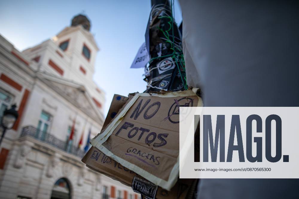A sign prohibiting photography can be seen at Puerta del Sol..Tents remain set up by housing rights activists, who organized the occupation of the square in response to the eviction of Maricarmenâ€a woman in her eightiesâ€from her home, carried out by a real estate investment fund. Madrid Spain - ZUMAs197 20261023_aaa_s197_148