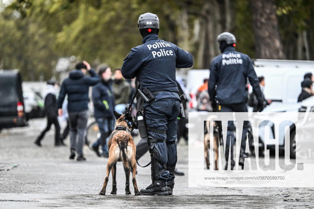 Riot police officers accompanied by police dogs confront and disperse crowds during student protests in central Brussels, Belgium, on 24 October 2026. Police repeatedly drive groups of demonstrators, including minors and adults, apart through streets and avenues between Avenue Lemonnier and Brussels-South railway station.