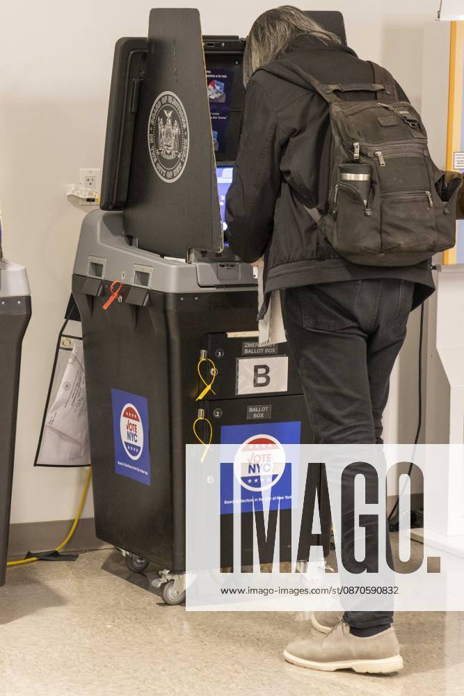 A Lower Manhattan resident scans their ballot at the Borough of Manhattan Community College polling site in Tribeca on the first day of early voting for the midterm elections in New York. New York USA - ZUMAr174 20261024_znp_r174_029