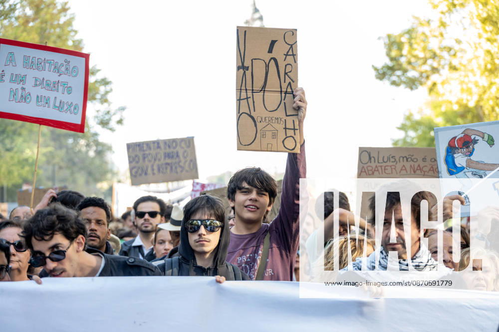 Demonstrators take part in a protest organized by the Acampada de Lisboa housing movement, demanding affordable housing, limits on rising rents and an end to property speculation. The march takes place in central Lisbon, from Marques de Pombal to Rossio Square, following recent police removal of protest tents and the detention of 55 demonstrators during housing protests in the Portuguese capital. Lisbon Portugal - ZUMAr238 20261024_zip_r238_062