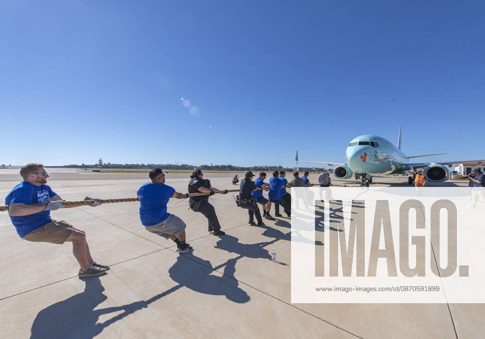 Teams compete in the 5th annual Alpha Resource Center Plane Pull, trying to pull a 140,000-pound Alaska Airlines 737 jetliner 20 feet in the fastest time. The event is a fundraiser for the Alpha Resource Center, a nonprofit serving people with disabilities and their families. Santa Barbara USA - ZUMAh13_ 20261024_zaf_h13_001