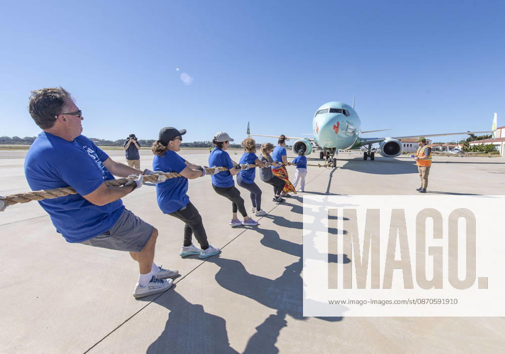 Teams compete in the 5th annual Alpha Resource Center Plane Pull, trying to pull a 140,000-pound Alaska Airlines 737 jetliner 20 feet in the fastest time. The event is a fundraiser for the Alpha Resource Center, a nonprofit serving people with disabilities and their families. Santa Barbara USA - ZUMAh13_ 20261024_zaf_h13_004