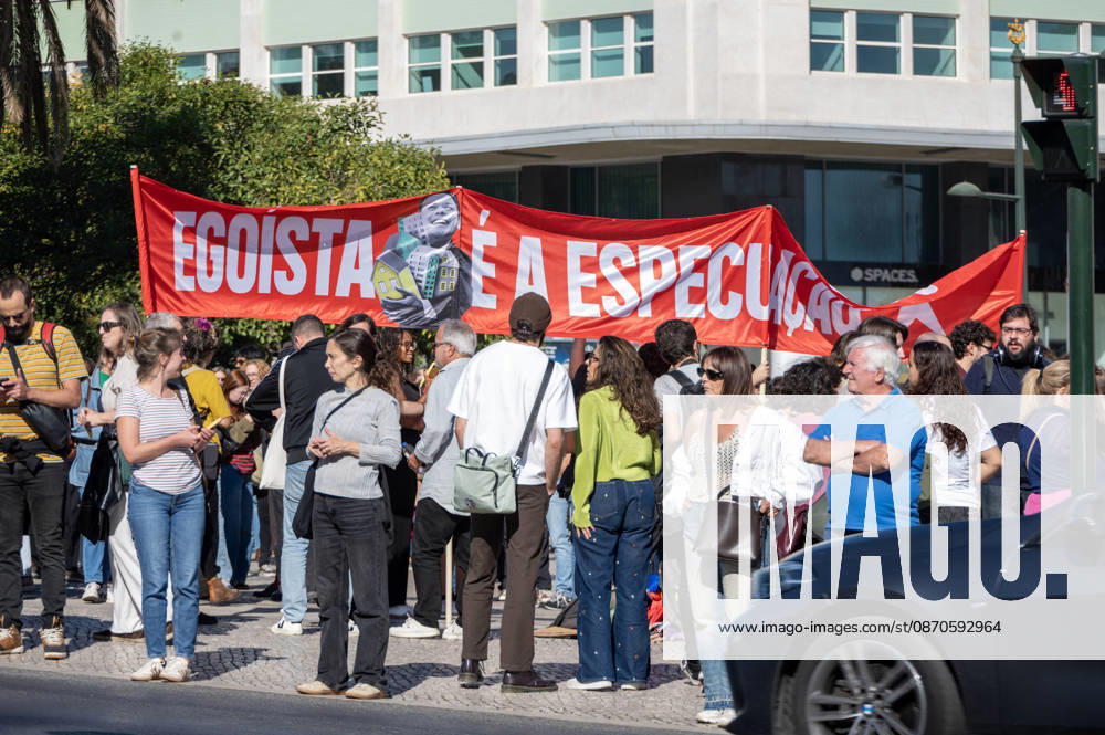 Demonstrators take part in a protest organized by the Acampada de Lisboa housing movement, demanding affordable housing, limits on rising rents and an end to property speculation. The march takes place in central Lisbon, from Marques de Pombal to Rossio Square, following recent police removal of protest tents and the detention of 55 demonstrators during housing protests in the Portuguese capital. Lisbon Portugal - ZUMAr238 20261024_zip_r238_024