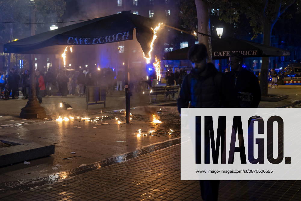 Police intervene during protest in Barcelona BARCELONA, SPAIN - OCTOBER 24: A youth protest organized through social media escalated into clashes with police, burning barricades and looting in central Barcelona, on October 24, 2026. Around 100 people, including 27 minors, were arrested after groups threw objects at police, set fire to rubbish containers and damaged shops around Placa de Catalunya, La Rambla and Ronda Universitat. Catalan President Salvador Illa condemned the violence and said those responsible would face consequences. Lorena Sopena Lopez Anadolu Barcelona Spain. Editorial use only. Please get in touch for any other usage.