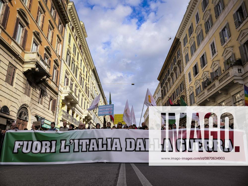 Rome Anti War Protest Demonstrators carry a banner reading Keep Italy Out of the War during an anti-war protest in Rome, Italy on October 24, 2026. Demonstrators took part in an anti-war march under the slogan Keep Italy Out of the War . Protesters further voiced opposition to Italy s involvement in armed conflicts, military rearmament and government policies. Rome Lazio Italy