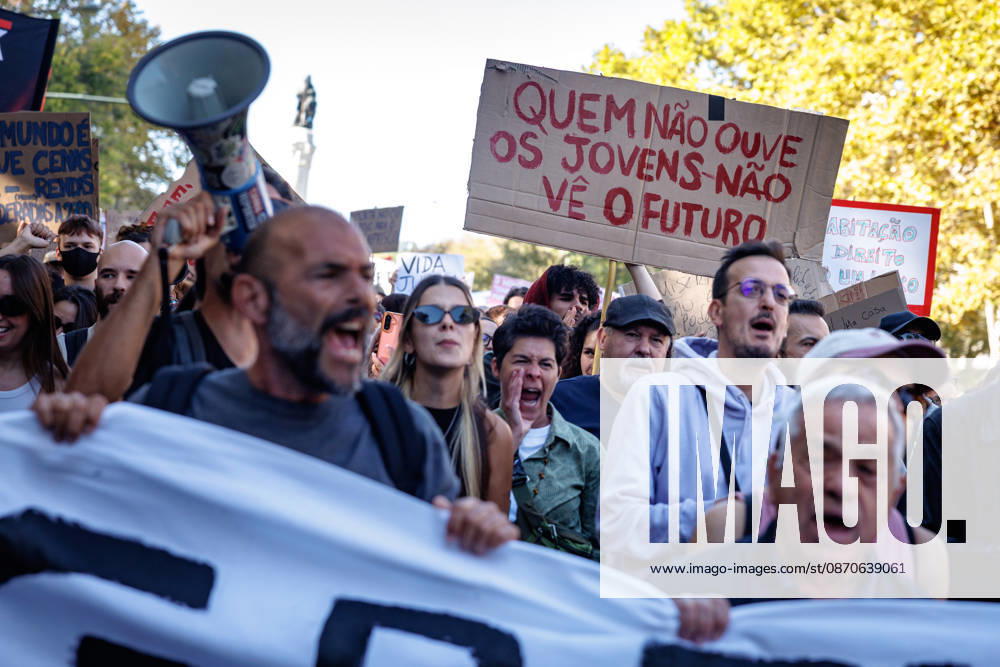 Protesters shout slogans during the demonstration. People march through central Lisbon during a demonstration demanding affordable housing and protesting against the rising cost of living. The protest started at Marques de Pombal and ended at Rossio Square, where demonstrators set up tents at the end of the march in protest against Portugal s housing crisis. Lisbon Portugal - ZUMAs197 20261024_aaa_s197_592