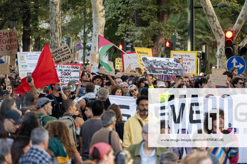Demonstrators take part in a protest organized by the Acampada de Lisboa housing movement, demanding affordable housing, limits on rising rents and an end to property speculation. The march takes place in central Lisbon, from Marques de Pombal to Rossio Square, following recent police removal of protest tents and the detention of 55 demonstrators during housing protests in the Portuguese capital. Lisbon Portugal - ZUMAr238 20261024_zip_r238_017