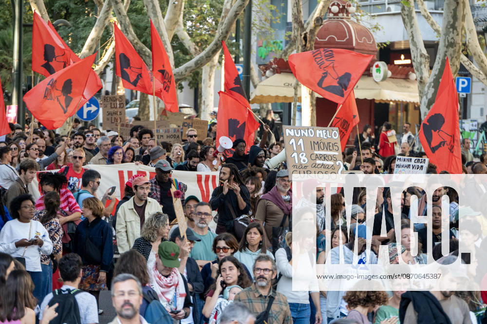 Demonstrators take part in a protest organized by the Acampada de Lisboa housing movement, demanding affordable housing, limits on rising rents and an end to property speculation. The march takes place in central Lisbon, from Marques de Pombal to Rossio Square, following recent police removal of protest tents and the detention of 55 demonstrators during housing protests in the Portuguese capital. Lisbon Portugal - ZUMAr238 20261024_zip_r238_021