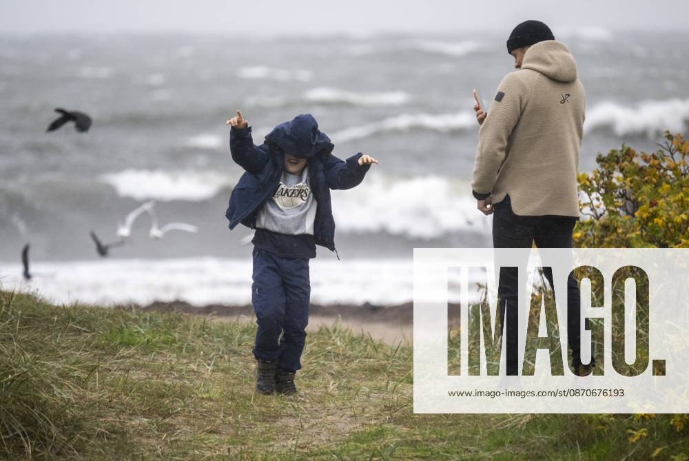 YSTAD, October 25, 2026: Storm watchers at Smabats Harbor in Ystad amid strong winds as Storm Boelo swept across southern Sweden on Sunday. YSTAD, SWEDEN