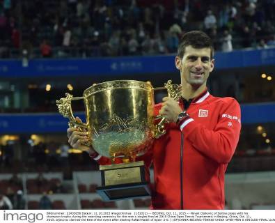 (151011) -- BEIJING, Oct. 11, 2015 -- Novak Djokovic of Serbia poses with his champion trophy during the awarding ceremony for the men s singles final at 2015 China Open Tennis Tournament in Beijing, China, Oct. 11, 2015. Djokovic claimed the title of the event after beating Rafael Nadal of Spain 2-0. ) (SP)CHINA-BEIJING-TENNIS-CHINA OPEN-MEN S SINGLES-FINAL LixWen