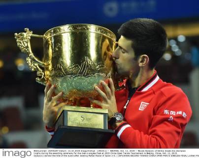 (151011) -- BEIJING, Oct. 11, 2015 -- Novak Djokovic of Serbia kisses his champion trophy during the awarding ceremony for the men s singles final at 2015 China Open Tennis Tournament in Beijing, China, Oct. 11, 2015. Djokovic claimed the title of the event after beating Rafael Nadal of Spain 2-0. ) (SP)CHINA-BEIJING-TENNIS-CHINA OPEN-MEN S SINGLES-FINAL LixWen