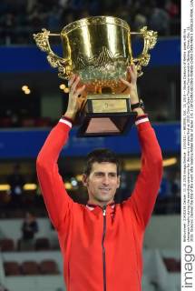 (151011) -- BEIJING, Oct. 11, 2015 -- Novak Djokovic of Serbia poses with his champion trophy during the awarding ceremony for the men s singles final at 2015 China Open Tennis Tournament in Beijing, China, Oct. 11, 2015. Djokovic claimed the title of the event after beating Rafael Nadal of Spain 2-0. ) (SP)CHINA-BEIJING-TENNIS-CHINA OPEN-MEN S SINGLES-FINAL LixWen