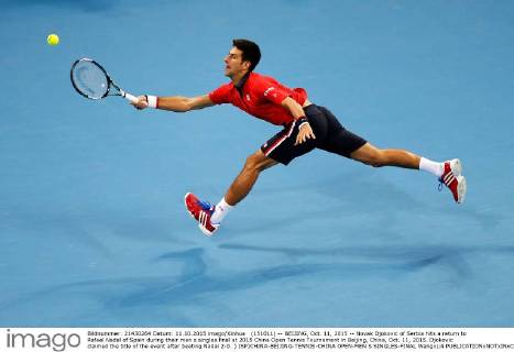 (151011) -- BEIJING, Oct. 11, 2015 -- Novak Djokovic of Serbia hits a return to Rafael Nadal of Spain during their men s singles final at 2015 China Open Tennis Tournament in Beijing, China, Oct. 11, 2015. Djokovic claimed the title of the event after beating Nadal 2-0. ) (SP)CHINA-BEIJING-TENNIS-CHINA OPEN-MEN S SINGLES-FINAL WangxLili
