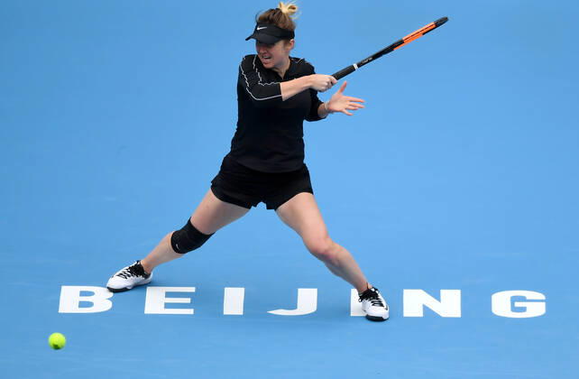 (191004) -- BEIJING, Oct. 4, 2019 -- Elina Svitolina of Ukraine hits a return during the women s singles quarterfinal match against Kiki Bertens of the Netherlands at 2019 China Open tennis tournament in Beijing, capital of China, Oct. 4, 2019. ) (SP)CHINA-BEIJING-TENNIS-CHINA OPEN-WOMEN S SINGLES(CN) LixYibo