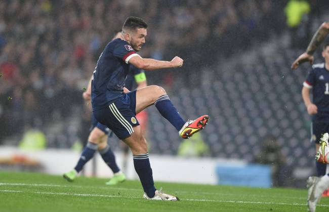 Glasgow, Scotland, 9th October 2021. John McGinn of Scotland scores Scotlands 1st goal during the FIFA World Cup, WM, Weltmeisterschaft, Fussball qualifiers match at Hampden Park, Glasgow. Picture credit should read: Neil Hanna Sportimage EDITORIAL USE ONLY. No use with unauthorised audio, video, data, fixture lists, club league logos or live services. Online in-match use limited to 120 images, no video emulation. No use in betting, games or single club league player publications. SPI-1226-0013