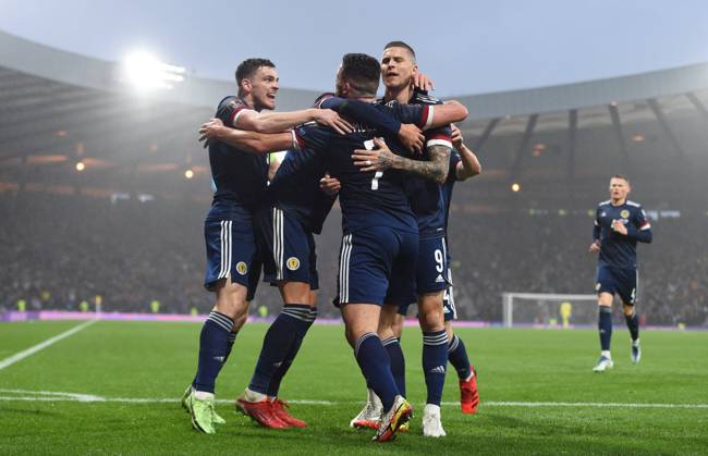Glasgow, Scotland, 9th October 2021. John McGinn of Scotland is mobbed by teammates after scoring ScotlandÕs 1st goal during the FIFA World Cup, WM, Weltmeisterschaft, Fussball qualifiers match at Hampden Park, Glasgow. Picture credit should read: Neil Hanna Sportimage EDITORIAL USE ONLY. No use with unauthorised audio, video, data, fixture lists, club league logos or live services. Online in-match use limited to 120 images, no video emulation. No use in betting, games or single club league player publications. SPI-1226-0020