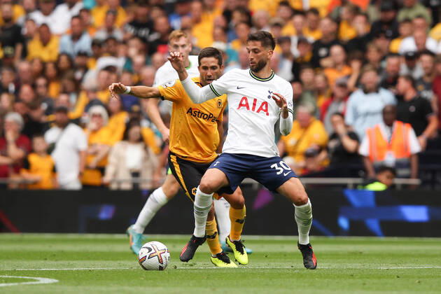 Rodrigo Bentancur of Tottenham Hotspur is challenged by Joao Moutinho of Wolverhampton Wanderers during the Premier League match between Tottenham Hotspur and Wolverhampton Wanderers at Tottenham Hotspur Stadium, London, England on 20 August 2022. Copyright: xKenxSparksx 32880075