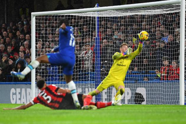 Chelsea v Bournemouth Premier League 27 12 2022. AFC Bournemouth goalkeeper Mark Travers (1) makes a save from Chelsea forward Raheem Sterling (17) during the Premier League match between Chelsea and Bournemouth at Stamford Bridge, London, England on 27 December 2022. London Stamford Bridge Greater London England Editorial use only DataCo restrictions apply See www.football-dataco.com , Copyright: xSimonxTraylenx PSI-16605-0018