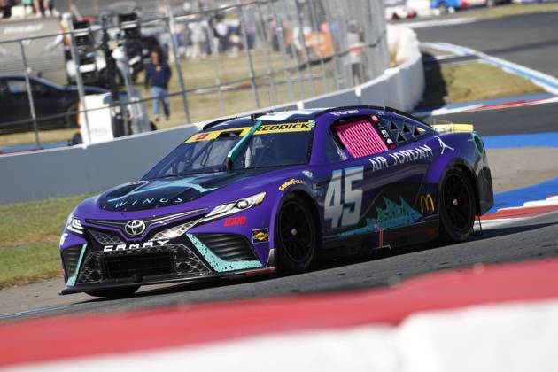 CHARLOTTE, NC - OCTOBER 08: Tyler Reddick ( 45 23XI Racing Jordan Brand Toyota) races into turn 5 during the running of the NASCAR, Motorsport, USA Cup Series Playoff Bank of America ROVAL 400 on October 8, 2023, at Charlotte Motor Speedway in Charlotte, NC. (Photo by Jeff Robinson Icon Sportswire) AUTO: OCT 08 NASCAR Cup Series Playoff Bank of America ROVAL 400 EDITORIAL USE ONLY Icon2310081881400