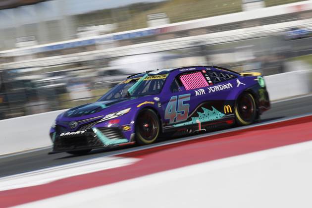CHARLOTTE, NC - OCTOBER 08: Tyler Reddick ( 45 23XI Racing Jordan Brand Toyota) races into turn 5 during the running of the NASCAR, Motorsport, USA Cup Series Playoff Bank of America ROVAL 400 on October 8, 2023, at Charlotte Motor Speedway in Charlotte, NC. (Photo by Jeff Robinson Icon Sportswire) AUTO: OCT 08 NASCAR Cup Series Playoff Bank of America ROVAL 400 EDITORIAL USE ONLY Icon2310082192400