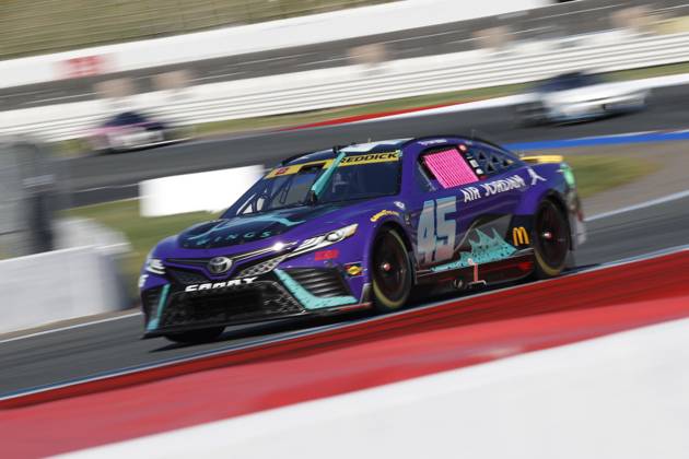 CHARLOTTE, NC - OCTOBER 08: Tyler Reddick ( 45 23XI Racing Jordan Brand Toyota) races into turn 5 during the running of the NASCAR, Motorsport, USA Cup Series Playoff Bank of America ROVAL 400 on October 8, 2023, at Charlotte Motor Speedway in Charlotte, NC. (Photo by Jeff Robinson Icon Sportswire) AUTO: OCT 08 NASCAR Cup Series Playoff Bank of America ROVAL 400 EDITORIAL USE ONLY Icon2310082214400