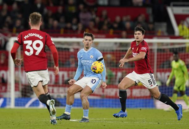 Manchester, England, 29th October 2023. Harry Maguire of Manchester United, ManU chasing after Jack Grealish of Manchester City during the Premier League match at Old Trafford, Manchester. Picture credit should read: Andrew Yates Sportimage EDITORIAL USE ONLY. No use with unauthorised audio, video, data, fixture lists, club league logos or live services. Online in-match use limited to 120 images, no video emulation. No use in betting, games or single club league player publications. SPI-2690-0057