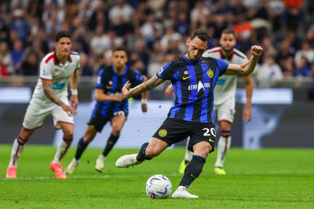 Hakan Calhanoglu of FC Internazionale scores a penalty during Serie A 2023 24 football match between FC Internazionale and Cagliari Calcio at Giuseppe Meazza Stadium, Milan, Italy on April 14, 2024 - Milan Stadio Giuseppe Meazza Milan Italy Copyright: xEPhotopressx SP24-912-035