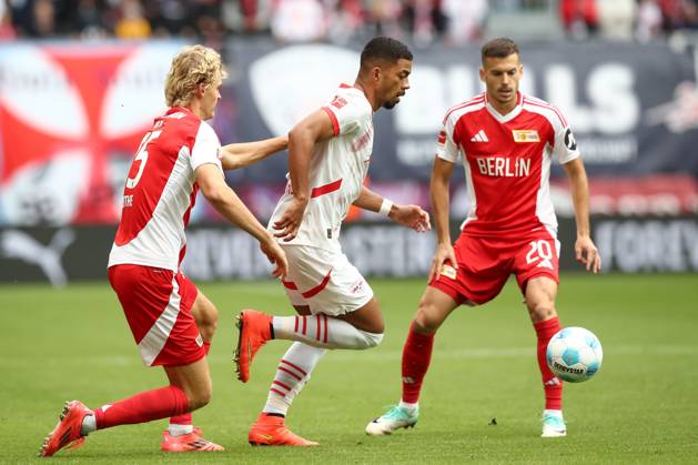 14.09.2024, xtgx, Fussball 1. Bundesliga, RB Leipzig - 1. FC Union Berlin emspor, v.l. Tom Rothe (Union Berlin, 15), Benjamin Henrichs (Leipzig) Zweikampf, Duell, Kampf, tackle Zweikampf, Duell, Kampf, tackle (DFL DFB REGULATIONS PROHIBIT ANY USE OF PHOTOGRAPHS as IMAGE SEQUENCES and or QUASI-VIDEO) Leipzig